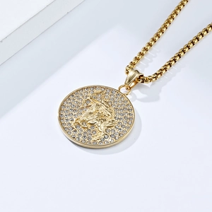 Macro detail of 18K gold Sagittarius medallion necklace with sparkling crystals