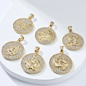 Macro view of 18K gold plated zodiac coin pendants with crystal pavé and hip hop style