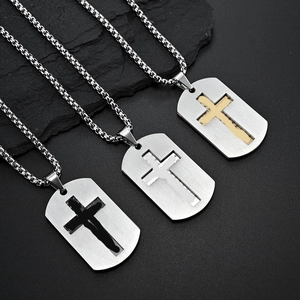 Detail of cross dog tag pendant with engraved scripture in black, gold, and silver finishes