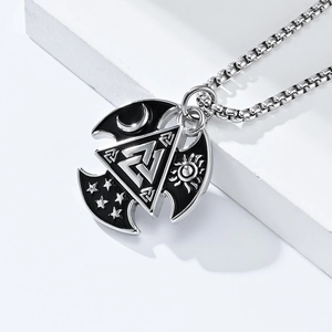 Macro shot of Viking Valknut pendant with moon and stars on a silver metal base