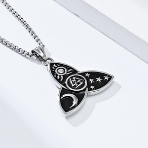 Macro view of Viking Valknut pendant with Celtic sun moon and star motifs on box chain