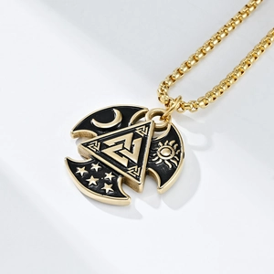 Detail view of Valknut Viking pendant with sun moon stars symbols and black enamel finish