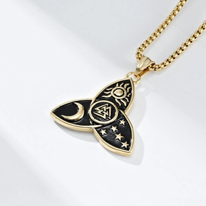 Macro shot of Viking Valknut pendant featuring celestial sun moon and star motifs