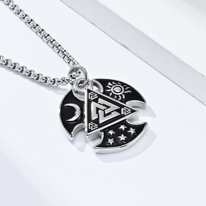 Macro shot of silver Valknut pendant with celestial moon and star details on a square chain