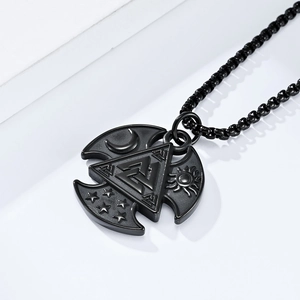 Macro detail of Nordic Viking Valknut pendant with moon star and sun celestial motifs