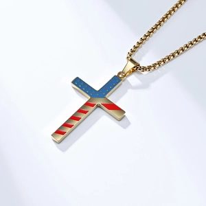Macro detail of golden cross pendant featuring American flag stars and stripes pattern
