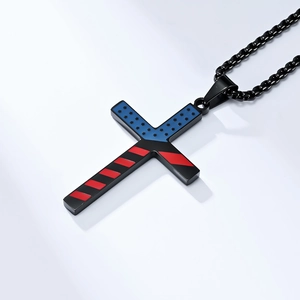 Close-up of stainless steel cross pendant with American flag design and black link chain