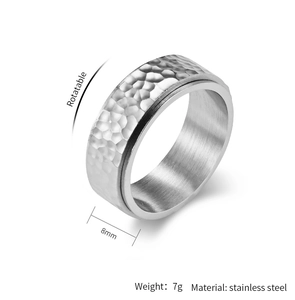 Close-up of 8mm rotatable stainless steel ring with hammered honeycomb texture finish