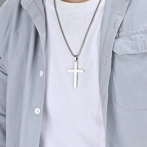 Star-engraved stainless steel cross pendant necklace with box chain on male model