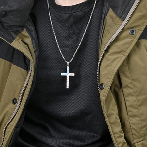 Titanium steel cross necklace with American flag design on olive green jacket