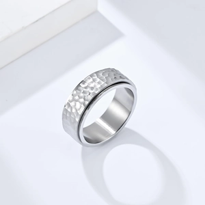 Minimalist hammered stainless steel spinning ring with textured silver finish for unisex style
