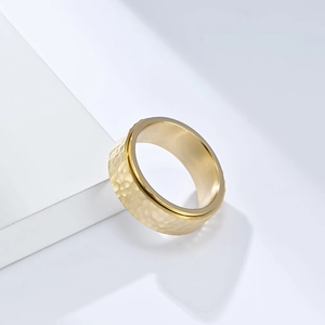 Golden titanium steel wide ring featuring a hammered honeycomb pattern for unisex wear