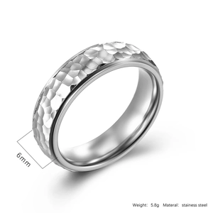 Detail showing 6mm width and 5.8g weight of hammered texture stainless steel ring