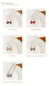 Detail view of five crystal bowknot U-shaped hairpins in various elegant colors