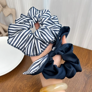 Blue and white striped scrunchie and dark blue satin hair tie with bow decoration