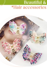 Close-up of double-layered butterfly hair claws in four ink-painting color patterns