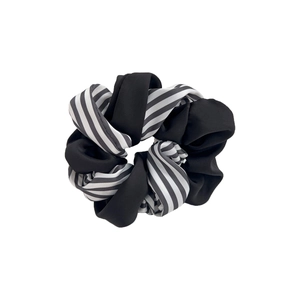 Two-tone scrunchie with black and white striped silk fabric for elegant ponytails