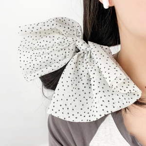 French vintage oversized bow hair scrunchie with black star pattern on white fabric