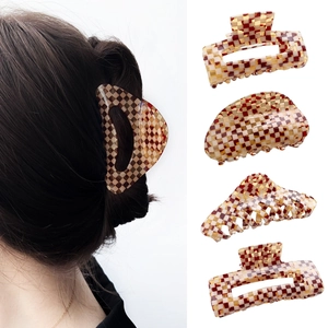 Brown and beige checkerboard acetate hair claws set in various geometric shapes