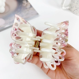 Pink ink-style butterfly hair claw clip with hollow double-layer design and marble texture