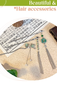 Detailed view of silver bamboo-style hair pins with green beads and elegant metal tassels
