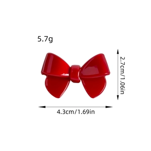 Red acetate bow hair clip for women with dimensions and weight 5.7g in a front view