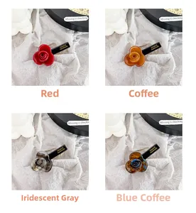 Detailed close-up of handmade acetic acid flower hair clips in four vibrant colors