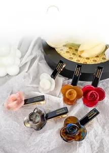 Detail view of retro acetate rose flower hair clips in six vibrant colors and gold metal base