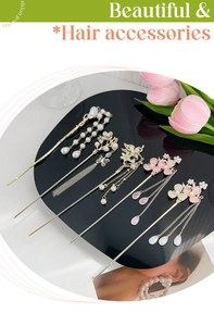 Detail view of a 6-piece Chinese style golden hair pin set with pearls and floral tassels