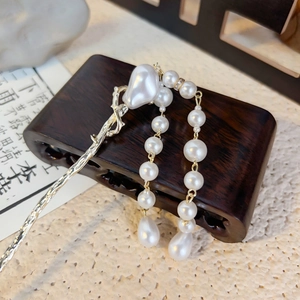 Elegant Chinese style silver plum blossom hair pin with pearl tassels on wood stand