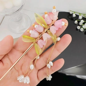 Elegante fermaglio per capelli mughetto con fiori in resina rosa e nappe d'oro