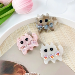 Three cute cat-shaped hair clips in pink and white marble acetate with heart rhinestones