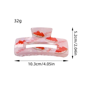 Pinza per capelli in acrilico rosa traslucido con motivo anguria e misura 10,3cm