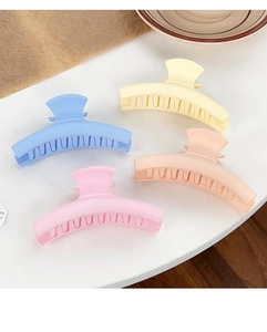 Set of four matte candy-colored claw clips in blue, yellow, pink and orange tones