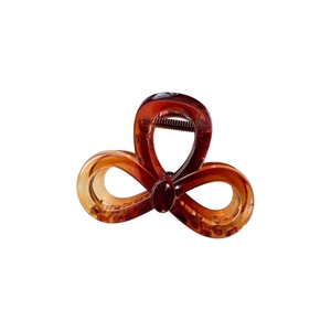 Elegant amber translucent resin bow hair claw clip with a stylish three-ring design