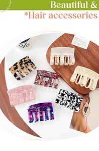 Flat lay of diverse acetate hair claws in tortoise shell and marble patterns