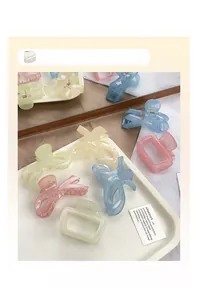 Macro shot of macaron colored transparent acrylic claw clips in various shapes