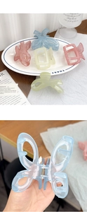 Close-up of matte square and butterfly hair claws in pastel translucent acrylic colors