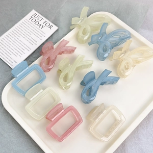 Square and bow-shaped matte hair claws in pastel colors for minimalist women styling