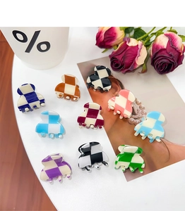 Detailed top view of 10-piece mini checkerboard hair claws in various vibrant colors