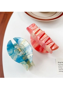 Set of two large glitter acetate hair claws with blue and pink marble textures
