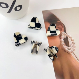 Classic black and white checkered heart-shaped hair claw clips made of acetate material