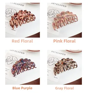 Detailed set of premium acetate claw clips in floral and marble patterns for elegant hair styling