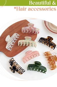 Detail showing high-quality acetate hair claws in various marble and tortoiseshell patterns
