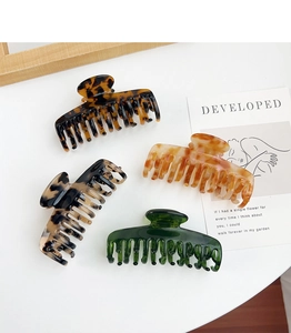 Selection of large acetate hair claws in tortoise shell and marble patterns for thick hair