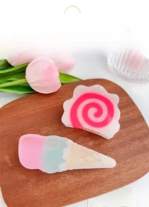 Detail view of pink dopamine acetate hair clips with ice cream and cloud patterns