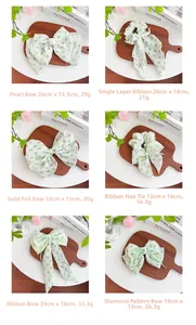 Detailed grid of light green fabric scrunchies and bow clips with dimensions and weights