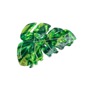 Tropical monstera leaf hair claw clip with green marble acetate pattern and silver veins