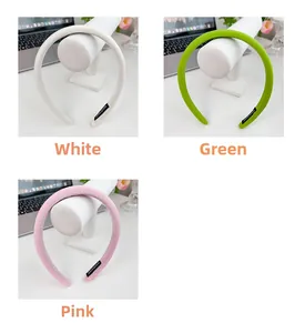 Detailed view of handmade thick sponge headbands in white green and pink colors