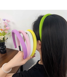 Set of five colorful sponge padded headbands in purple pink white yellow and neon green